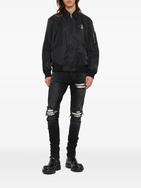 Undercover logo-print zip-up jacket